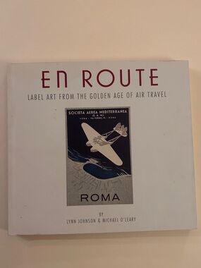 Chronicle Books EN ROUTE Hardcover in White and Maroon